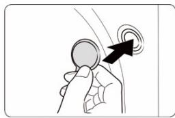 Illustration of a hand holding a circular object with an arrow pointing to a circular target (no text or symbols)