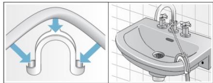 Illustration of a pipe fitting and sink with blue arrows indicating flow direction (no text or symbols)