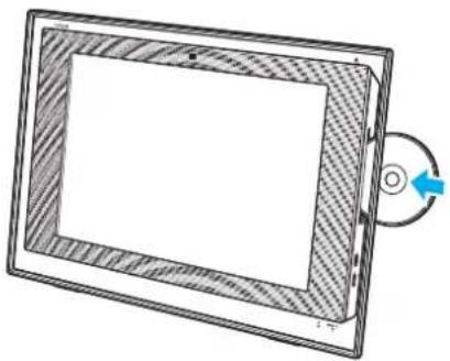 Technical line drawing of a rectangular electronic device with a circular button and arrow indicating rotation (no text or symbols)