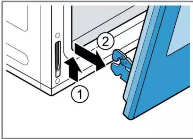Diagram showing a mechanical assembly with labeled parts and directional arrows indicating movement or force.