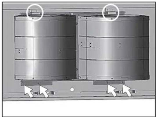Two metallic cylindrical tanks mounted on a base, with arrows pointing to the side of each tank (no text or symbols visible)