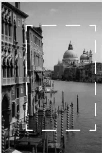 Black-and-white photo of a Venetian canal with historic buildings and a domed cathedral in the background (no visible text or symbols)