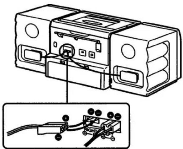 Technical line drawing of a portable electronic device with ports and cables, showing internal wiring connections (no text or symbols)