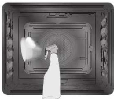 Top-down view of a spray gun spraying through a circular vent (no text or symbols visible)