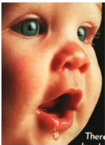 Close-up of a baby's face showing a droplet and open mouth (no text or symbols)