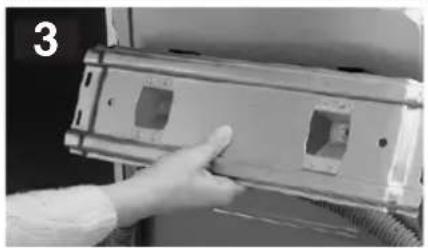 Hand inserting a component into a device housing (no visible text or symbols)