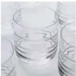 Close-up of clear glass cups on a surface (no text or symbols visible)