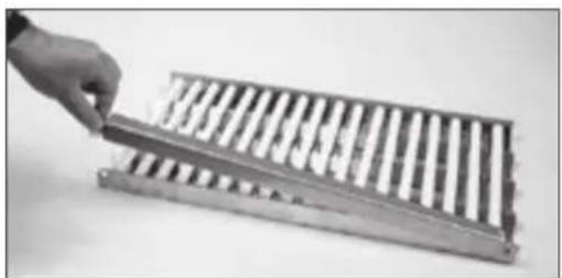 Hand holding a wooden abacus with metal rods (no visible text or symbols)