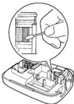 Diagram showing a hand inserting a component into a device (no text or symbols visible)