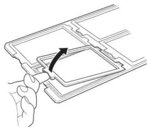 Line drawing of a hand inserting a component into a device casing (no text or symbols)