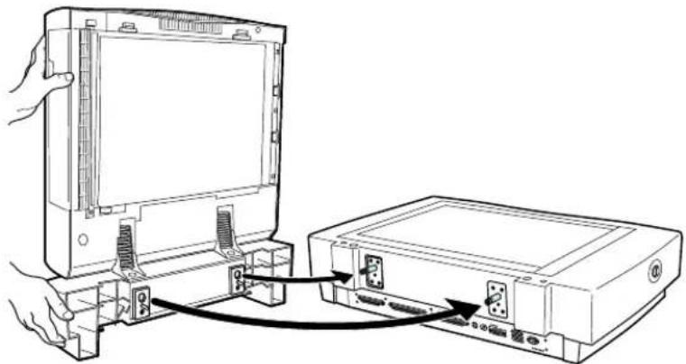 Line drawing of a hand connecting an open monitor to a device with cable (no text or symbols visible)