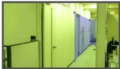 Interior view of a hallway with yellow walls and doors, no visible text or symbols