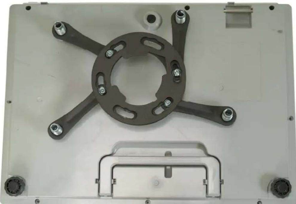 Metallic mechanical component with central circular feature and multiple bolted joints (no text or symbols visible)