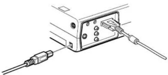 Technical line drawing of a device with two cables connected to a connector (no text or symbols)