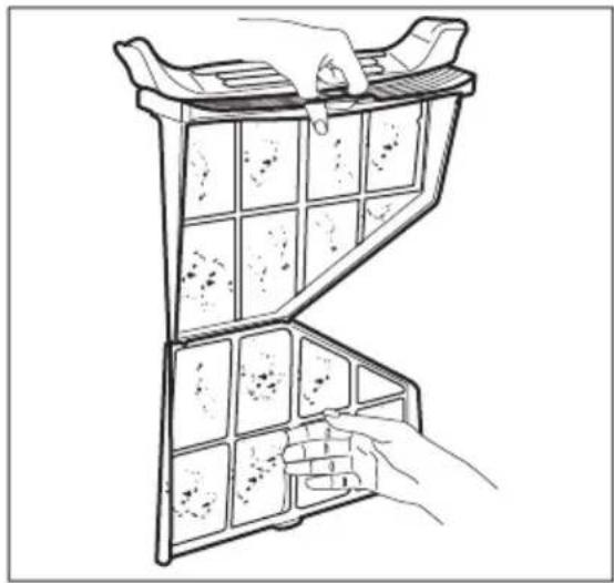 Line drawing of a hand inserting a grid into a device (no text or symbols)