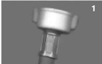 Close-up of a metallic mechanical component with a cylindrical top and flanged shaft (no visible text or symbols)