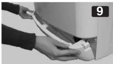 Close-up of hands installing or adjusting a white cable or cable component on an air conditioner (no visible text or symbols)