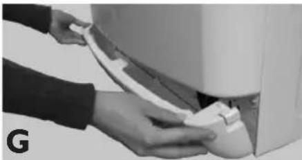 Close-up of hands installing or adjusting a white cable on a wall-mounted air conditioner unit (no visible text or symbols)
