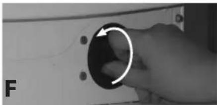 Close-up of a hand holding a circular knob with an arrow, no visible text or symbols