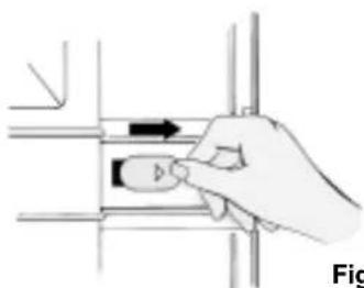 Hand holding a small object with an arrow, no visible text or symbols