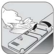 Illustration of a hand cleaning a small object on a device (no text or symbols visible)