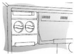 Diagram of a refrigerator interior showing two circular windows and a door, with no visible text or symbols.