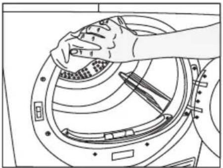 Line drawing of hands cleaning a circular mechanical component with tools (no text or symbols)