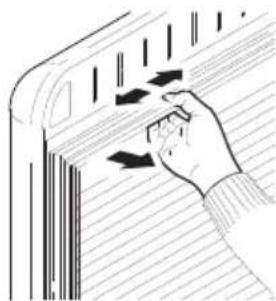 Hand pressing down on a striped surface with arrows indicating motion or force (no text or symbols)