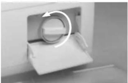 Close-up of a mechanical component with a circular arrow indicating rotation (no text or symbols visible)