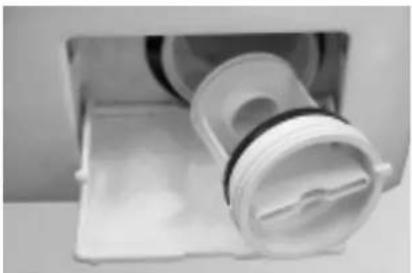 Close-up of a white plastic washing machine with a coiled roller and side panel (no visible text or symbols)