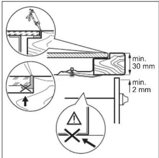 Diagram showing a grid-patterned plate being cut into a square plate, with additional rollers and a downward arrow indicating process (no text or symbols)