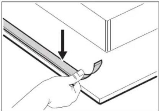 Illustration of a hand using a tool to cut or mark a piece of wood, with an arrow indicating the process (no text or symbols present)
