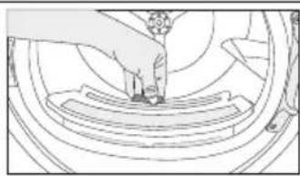 Line drawing of a mechanical assembly with a foot pressing a circular component (no text or symbols)