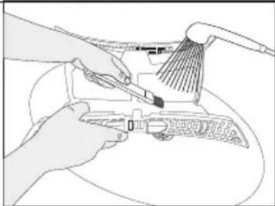 Line drawing of hands using a tool to clean or adjust a component (no text or symbols visible)