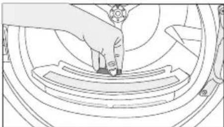 Line drawing of a person pressing down on a curved mechanical component (no text or symbols)