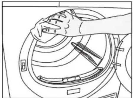 Line drawing of a hand cleaning a circular mechanical component (no text or symbols)