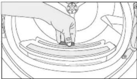 Line drawing of a hand pressing down on a mechanical component (no text or symbols)