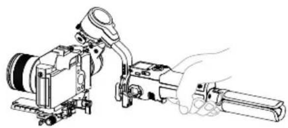 Line drawing of a camera setup with a handheld tool and mechanical components (no text or symbols)
