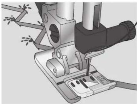 Mechanical assembly diagram showing a sewing machine needle inserted into a base socket (no text or symbols visible)