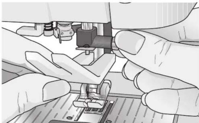 Close-up of hands operating a sewing machine needle (no visible text or symbols)