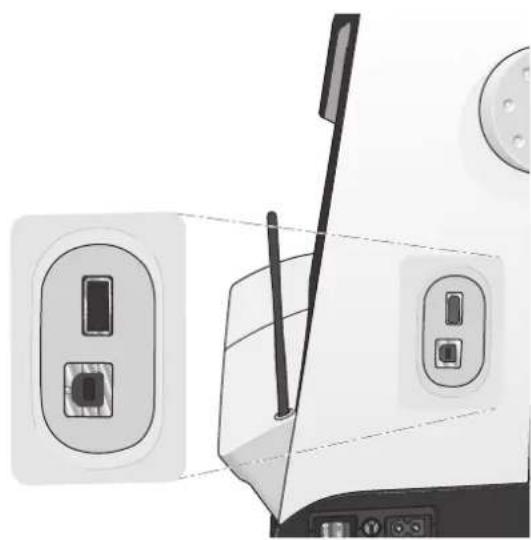 Close-up of a mechanical device showing a switch inserted into a socket, with no visible text or symbols.