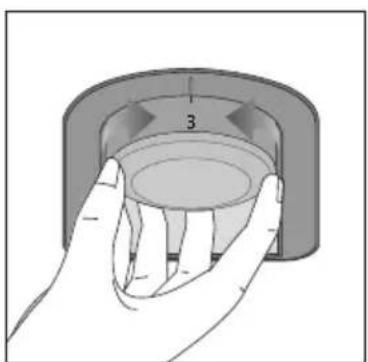 Hand holding a circular mechanical component with a numbered arrow and '3' label (no text or symbols on the component itself)