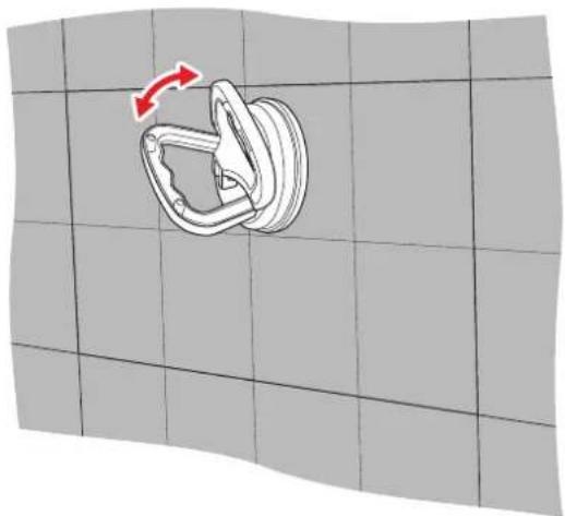 Diagram of a mechanical clamp or spring mechanism on a grid background, with no visible text or symbols.
