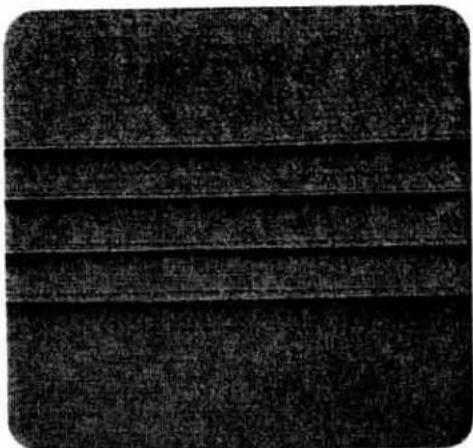 Close-up of a textured fabric surface with horizontal striations (no visible text or symbols)