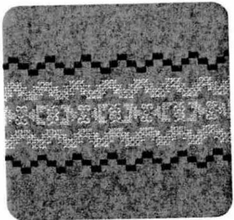 Abstract pixelated pattern with black and white blocks on a textured gray background (no text or symbols)