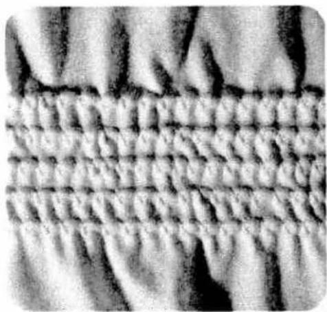 Close-up of a textured fabric with parallel grooves and ridges (no text or symbols)