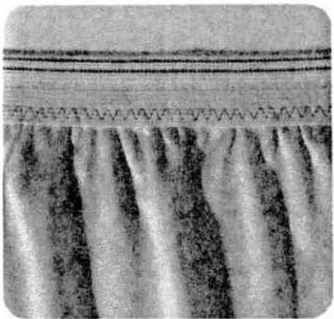 Close-up of a textured surface with vertical striations and horizontal lines, no visible text or symbols