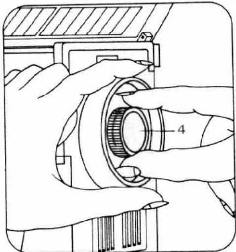 Illustration of hands operating a mechanical component with a numbered part (4), no text or symbols present.