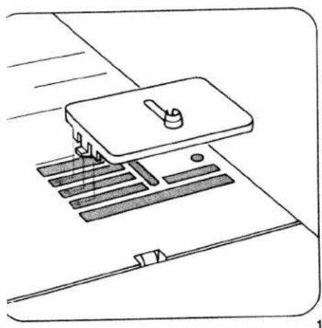 Line drawing of a sewing machine with handle and base components (no text or symbols)