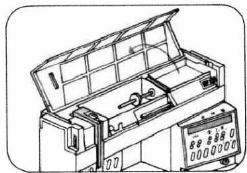 Line drawing of an open industrial machine with control panel and display (no text or symbols)